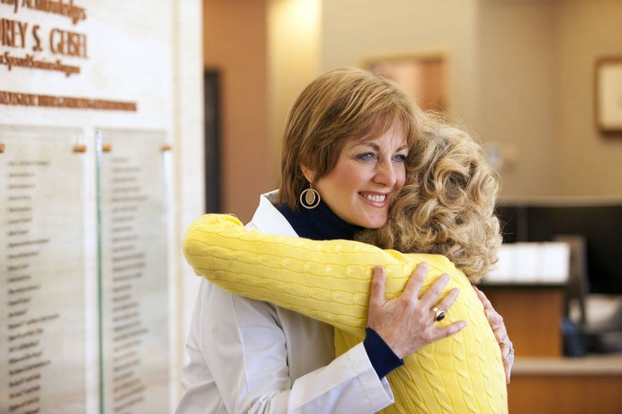 A patient hugs a Scripps physician.