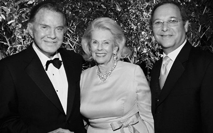 Philanthropist Betty Knight Scripps (center) with actor Cliff Robertson (left). She was a longtime supporter of Scripps Health and chaired the Candlelight Ball six times. The ball raised more than $16 million during her tenure.