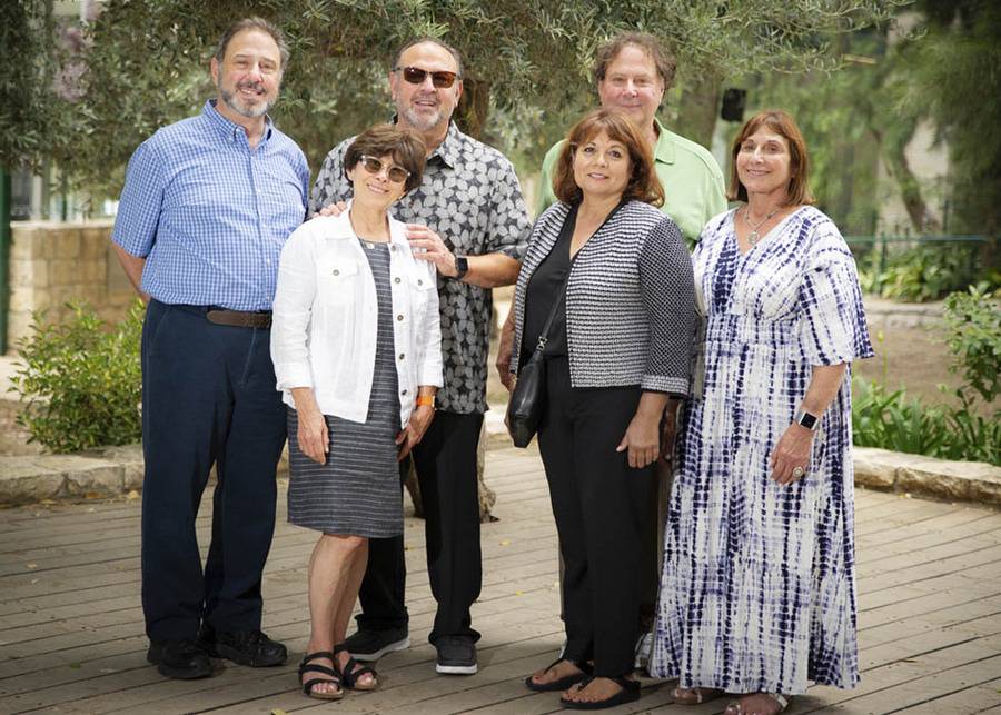 Members of the Cohn family standing on a patio