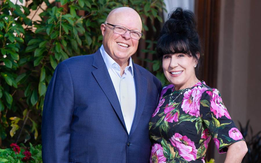 Gerry and Jeannie Ranglas smile at an outdoor event.