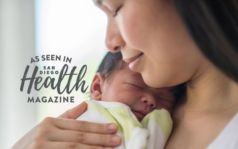 A mother cuddles with her newborn, representing how Scripps Health continues to grow for the good of the community.