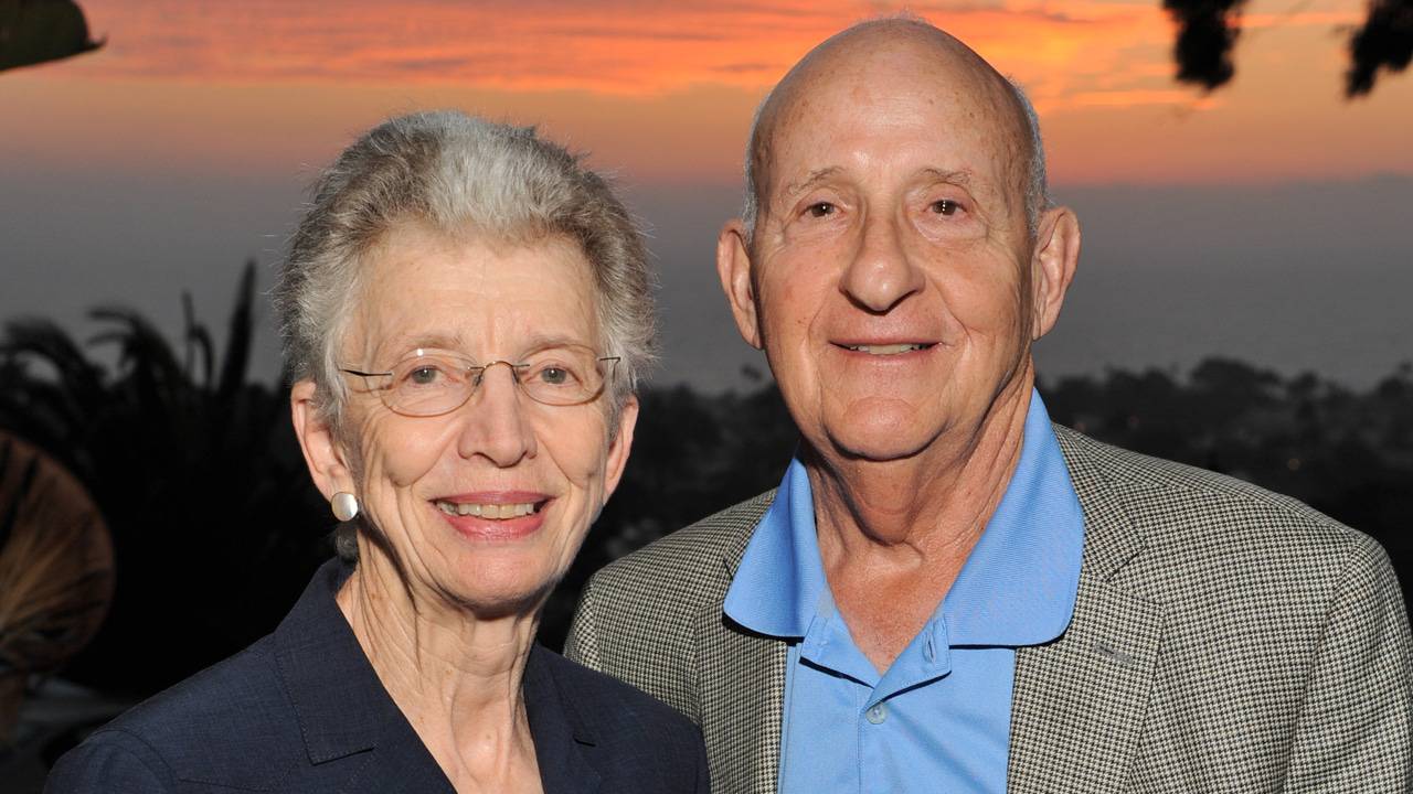 Ernest and Evelyn Rady pictured at sunset with the ocean in the background.
