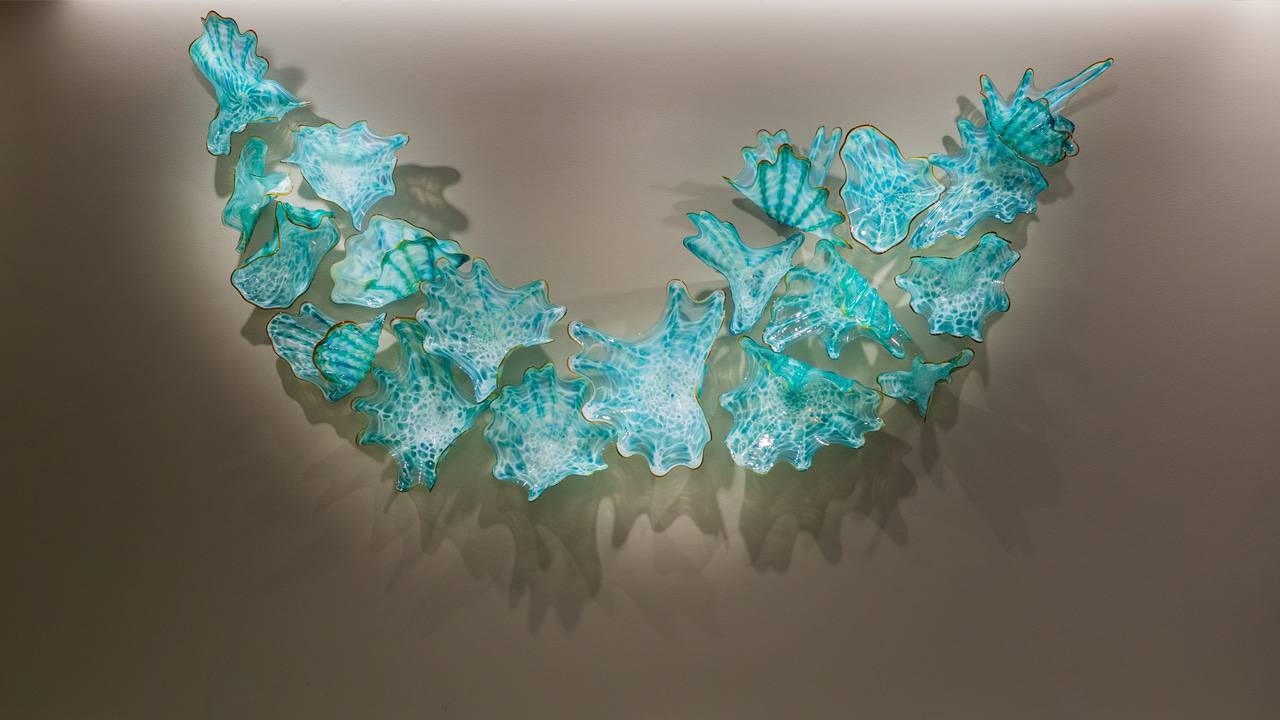 A hand-blown glass piece drawing beauty from the serene beauty of water and shells is an example of the Healing Art displayed at Lusardi Tower at Scripps Memorial Hospital Encinitas.