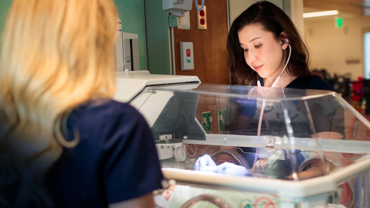Two nurses check on a newborn baby in the level III NICU at Rady Tower at Scripps Memorial Hospital La Jolla.