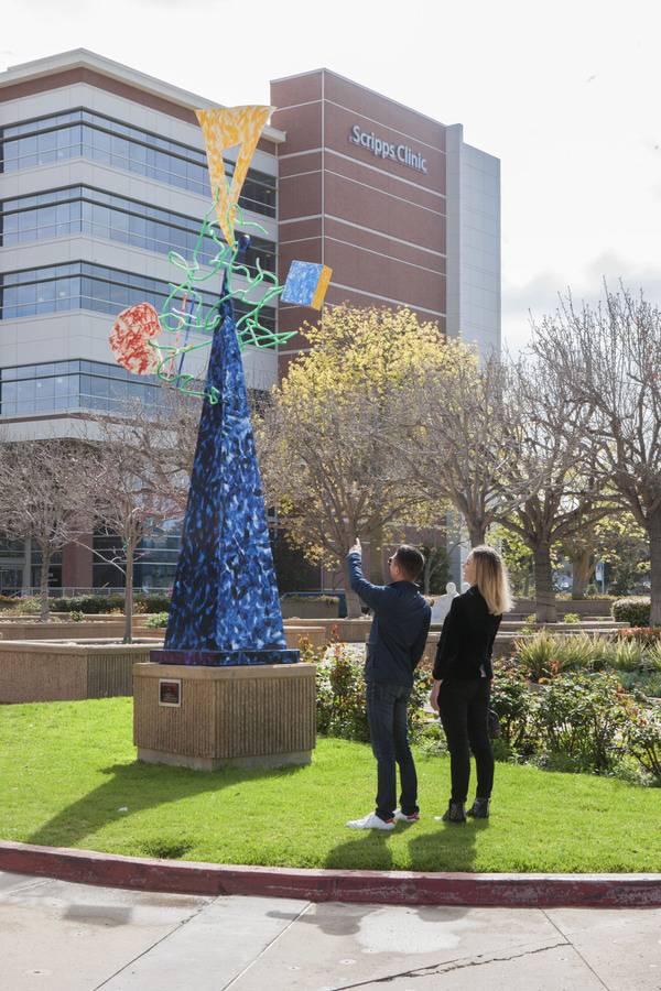 Two patients admire the artwork outside Scripps Clinic La Jolla.