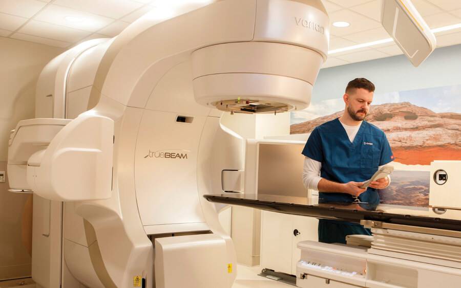 A Scripps radiologist uses a linear accelerator machine in treating cancer patients.