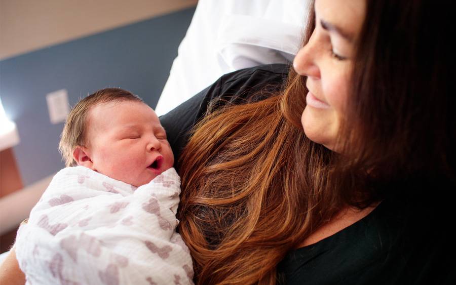 A mother holds her new baby.