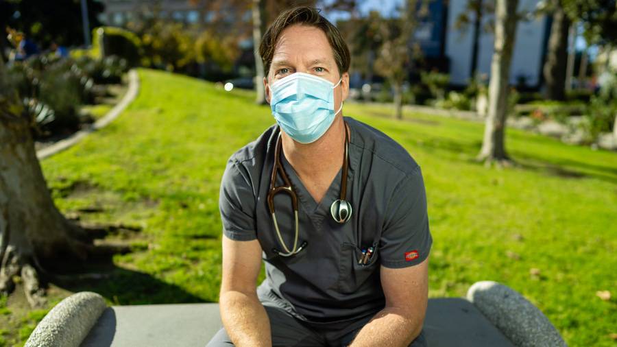Greg Knight, RN, sits outside Scripps Mercy Hospital Chula Vista.