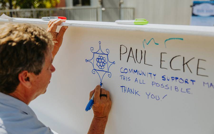 Paul Ecke signs a beam during the construction of the Lusardi Tower at Scripps Memorial Hospital Encinitas.