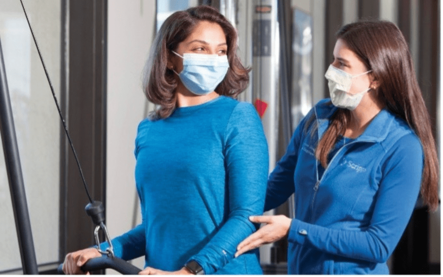 A medical professional helps a patient