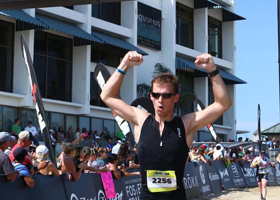 Rob Church crosses the finish line at the Santa Cruz Half Ironman.